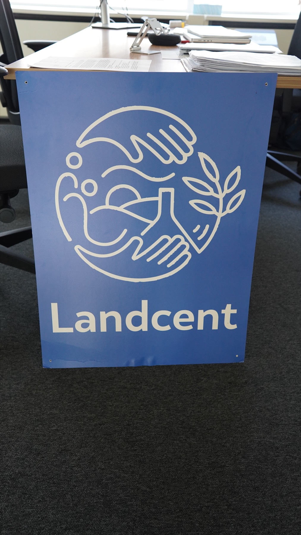 Landcent banner at a table